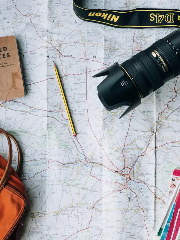 Traveller with map planning a trip — travel insurance