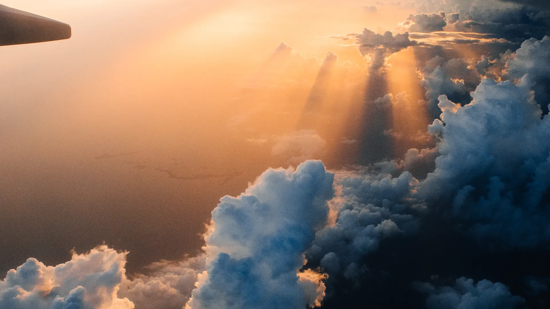 Traveller standing before a breathtaking mountain panorama at golden hour