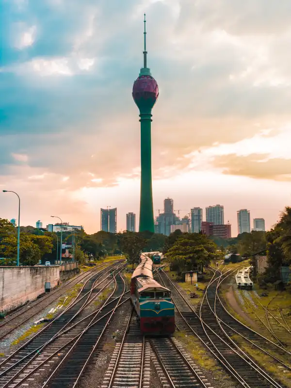 Iconic Kuala Lumpur towers framed by tropical gardens at twilight